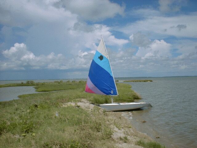 sailboat up on beach 